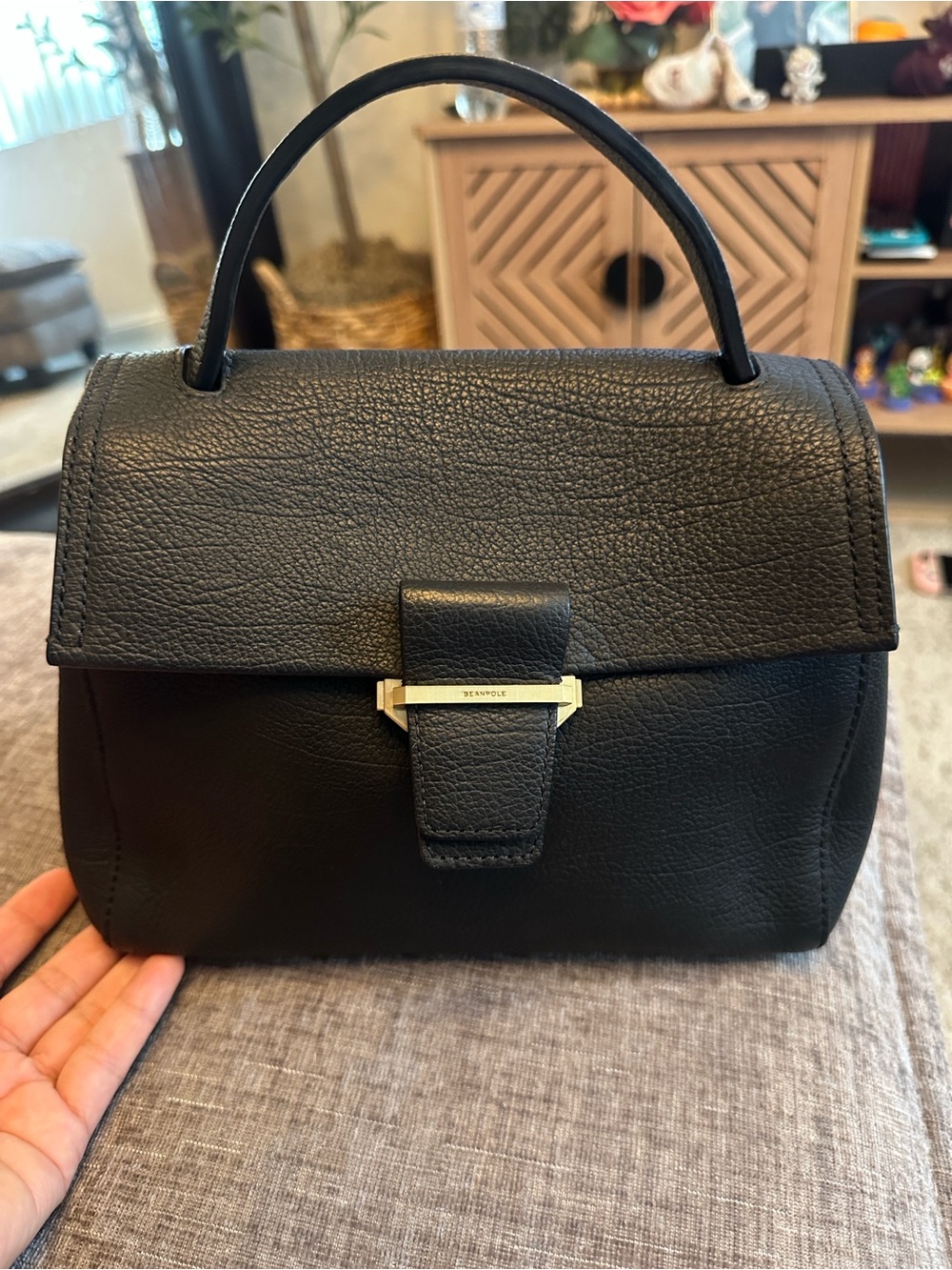 Structured Black Leather Top-Handle Handbag with Gold Accent